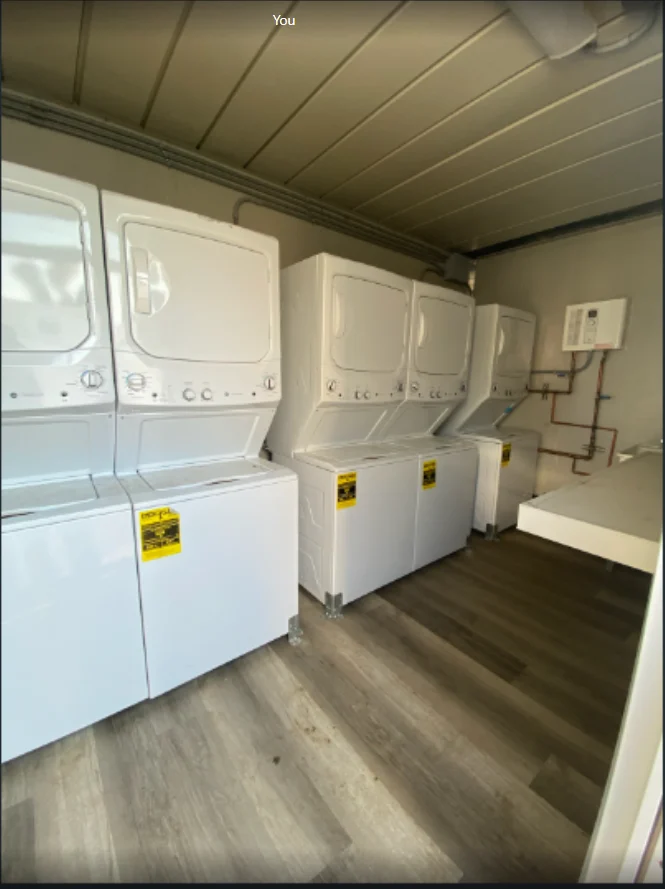 Stacked laundry machines inside the container