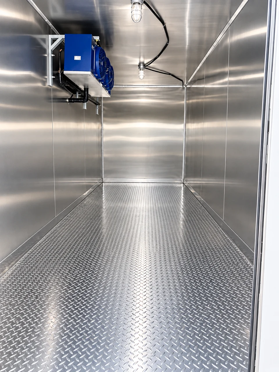 Opposite-end view of the insulated refrigerated interior and cooling equipment