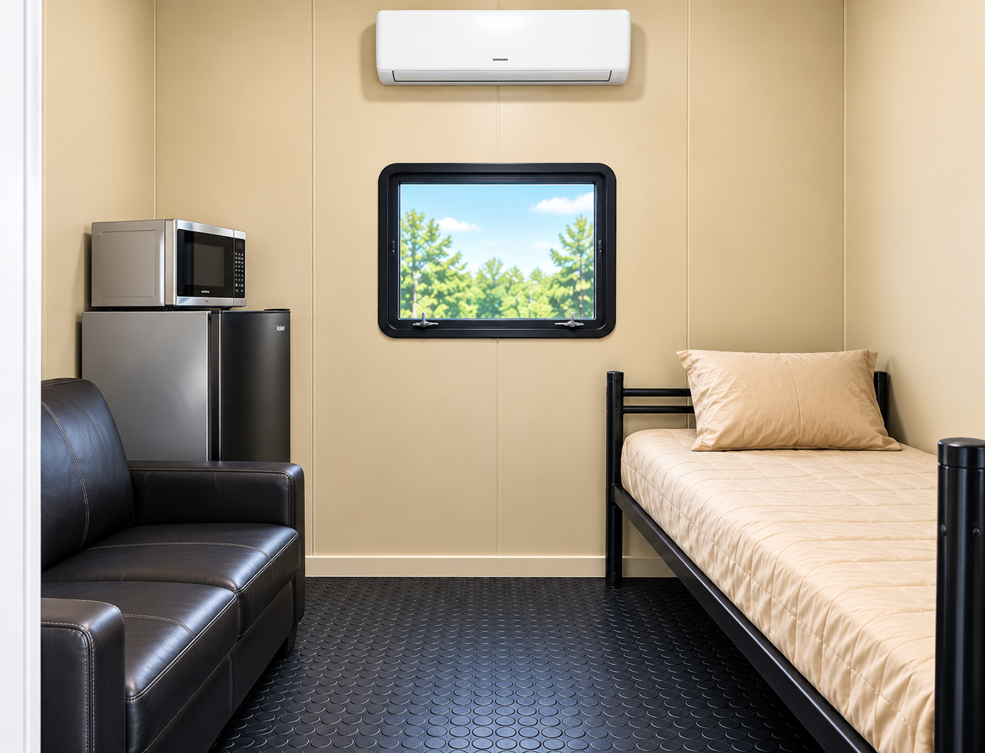 Private room inside a remote workforce accommodation unit with a bed, seating, cooling and compact appliances